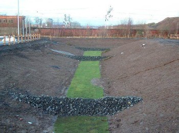 Swale with check dams Swale with check dams